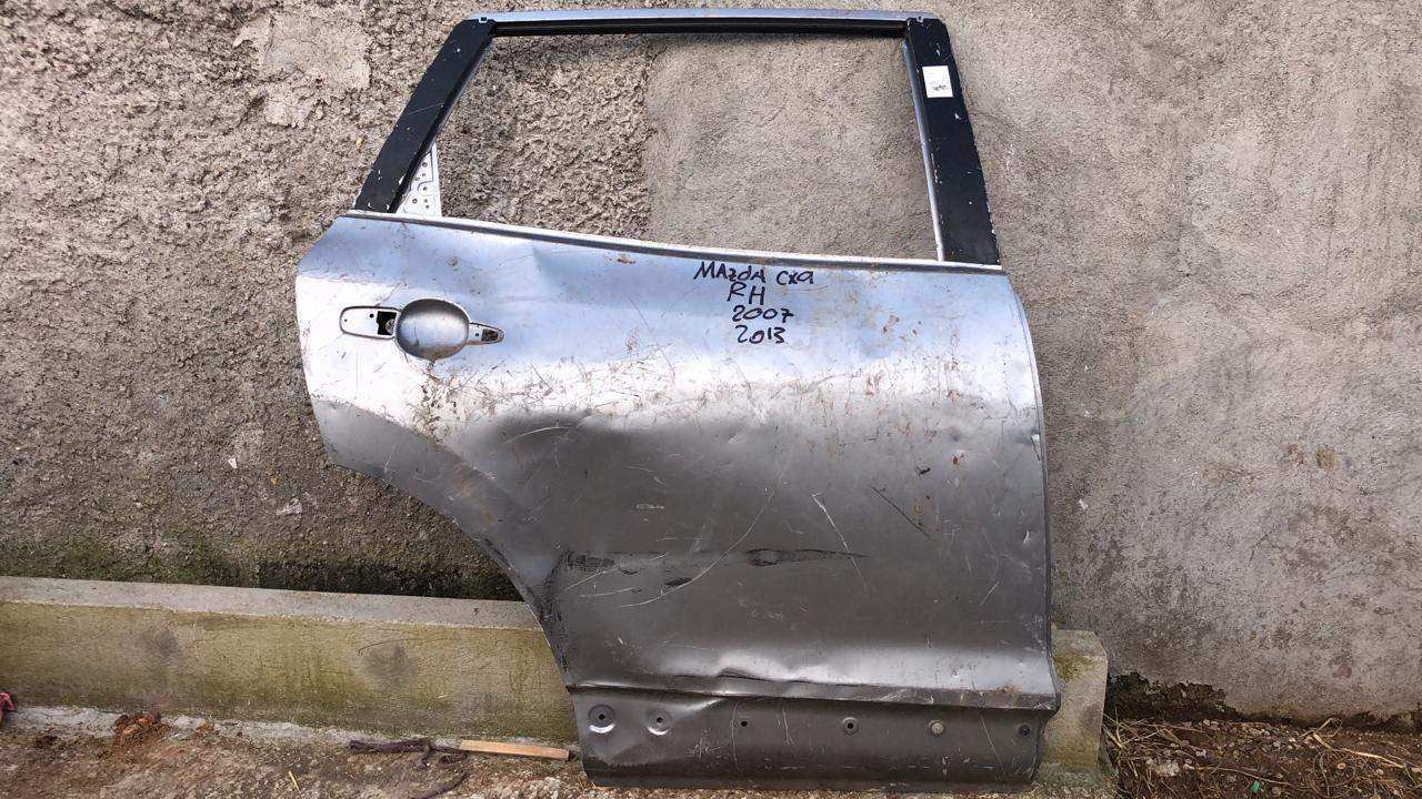 Puerta trasera derecha mazda cx9 2013 2015 - Grupo Revisa