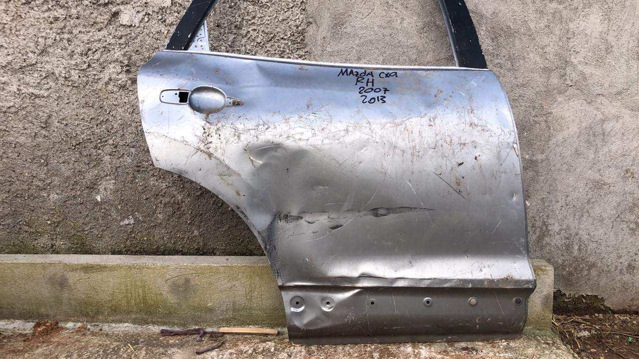 Puerta trasera derecha mazda cx9 2013 2015 - Grupo Revisa